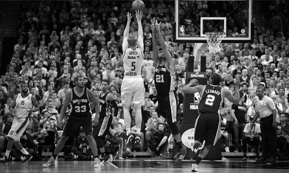 Giffey shoots over Tim Duncan of the Spurs